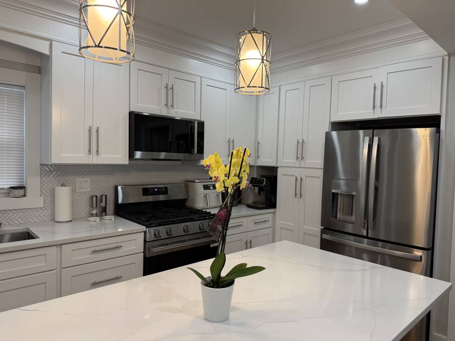 Quartz island kitchen with pendant lights