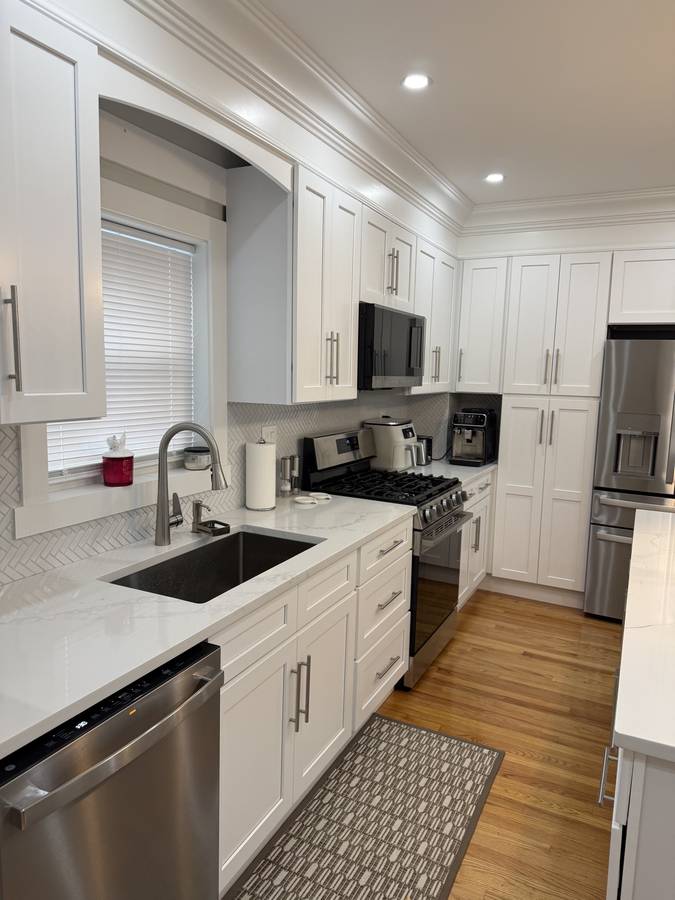 White kitchen with herringbone backsplash